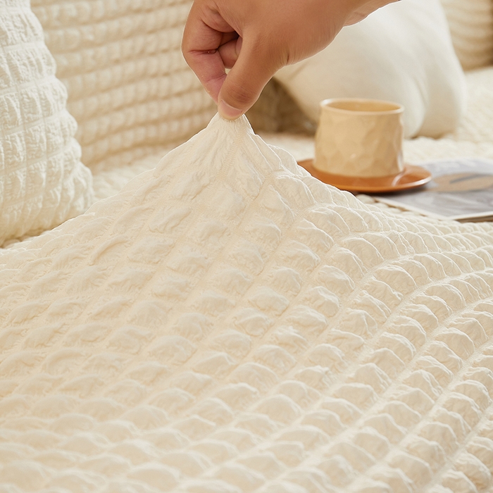 91家纺网 家纺一手货源 找家纺 丝绮鹿 2025新款泡泡爆米花系列—直排松紧款沙发套 乳白