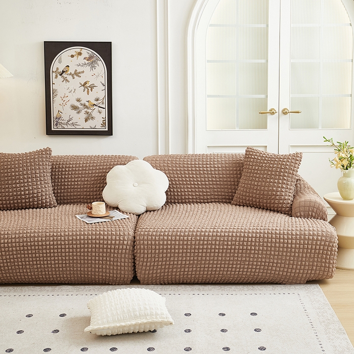 91家纺网 家纺一手货源 找家纺 丝绮鹿 2025新款泡泡爆米花系列—直排松紧款沙发套 驼色