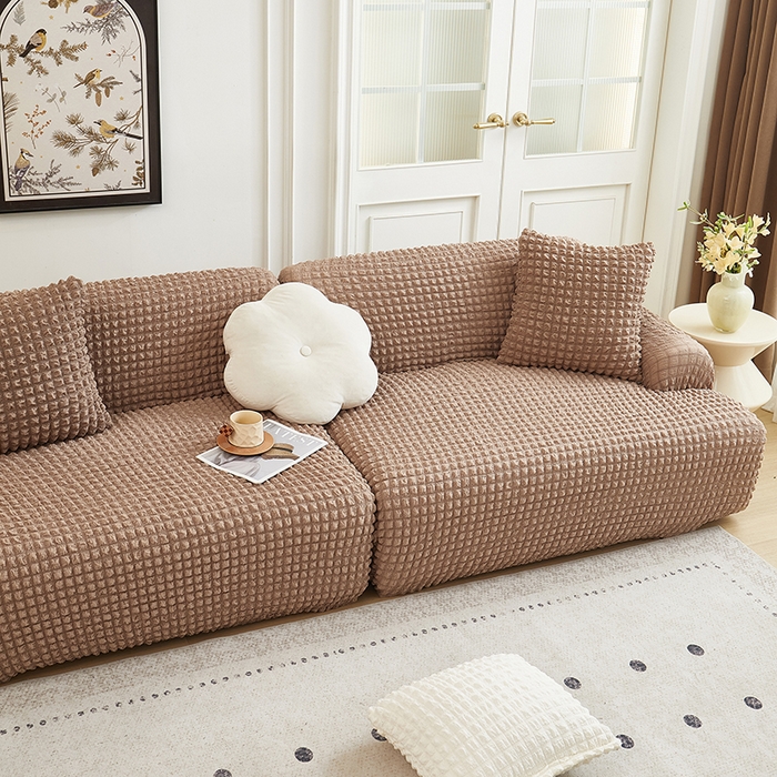 91家纺网 家纺一手货源 找家纺 丝绮鹿 2025新款泡泡爆米花系列—直排松紧款沙发套 驼色