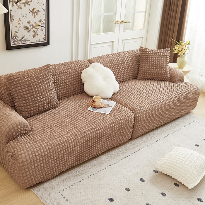 91家纺网 家纺一手货源 找家纺 丝绮鹿 2025新款泡泡爆米花系列—直排松紧款沙发套 驼色