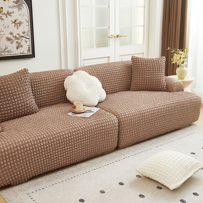 91家纺网 家纺一手货源 找家纺 丝绮鹿 2025新款泡泡爆米花系列—直排松紧款沙发套 驼色