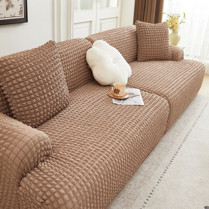 91家纺网 家纺一手货源 找家纺 丝绮鹿 2025新款泡泡爆米花系列—直排松紧款沙发套 驼色