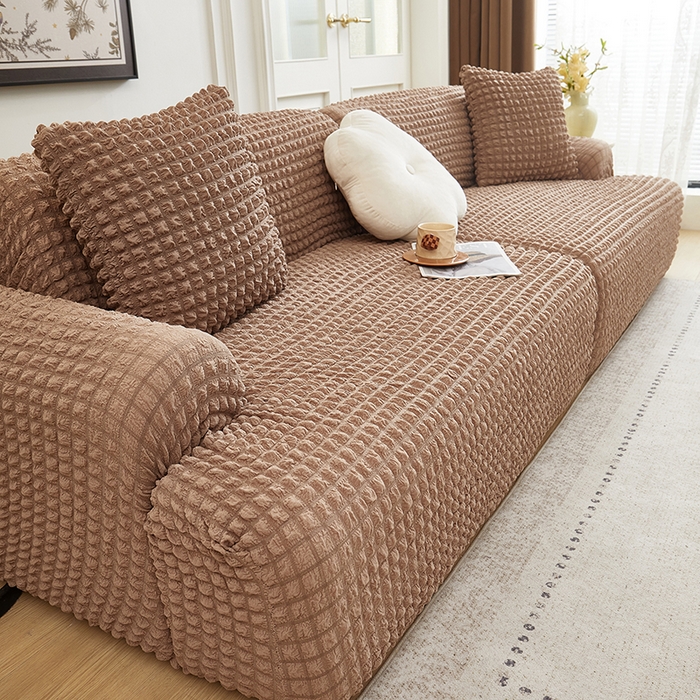 91家纺网 家纺一手货源 找家纺 丝绮鹿 2025新款泡泡爆米花系列—直排松紧款沙发套 驼色