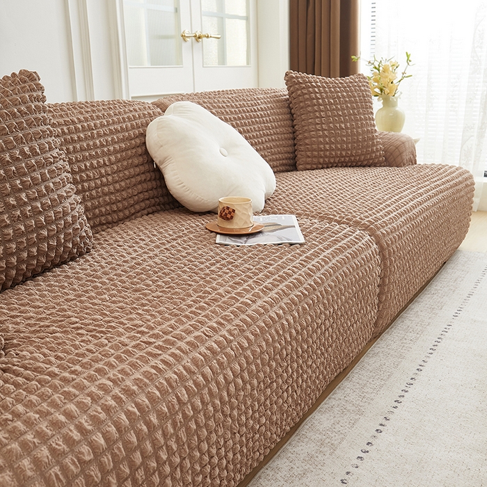 91家纺网 家纺一手货源 找家纺 丝绮鹿 2025新款泡泡爆米花系列—直排松紧款沙发套 驼色