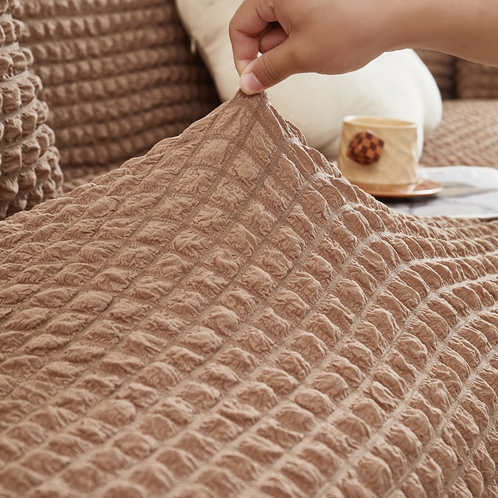 91家纺网 家纺一手货源 找家纺 丝绮鹿 2025新款泡泡爆米花系列—直排松紧款沙发套 驼色