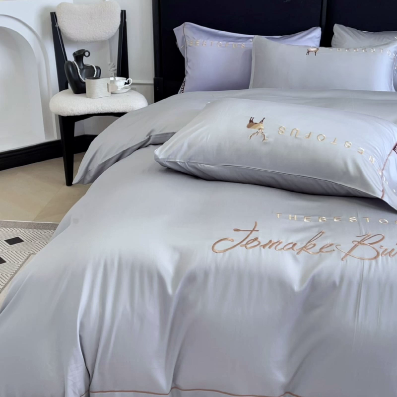 91家纺网 家纺一手货源 找家纺 2025新款夏季爆款A类兰精天丝四件套真丝重工刺绣丝滑裸睡床单床笠轻奢风纯色简约床上用品 妮鹿-朦胧灰