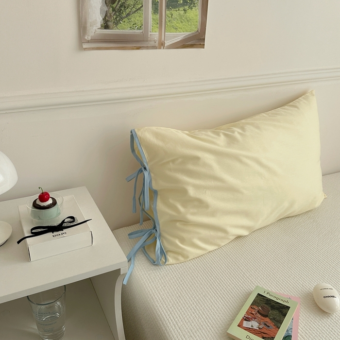 91家纺网 家纺一手货源 找家纺 尺素 2025新款纯棉绑带款ins风博主单枕套全棉成人枕头套纯色蝴蝶结枕芯枕套 绑带枕套 奶油黄