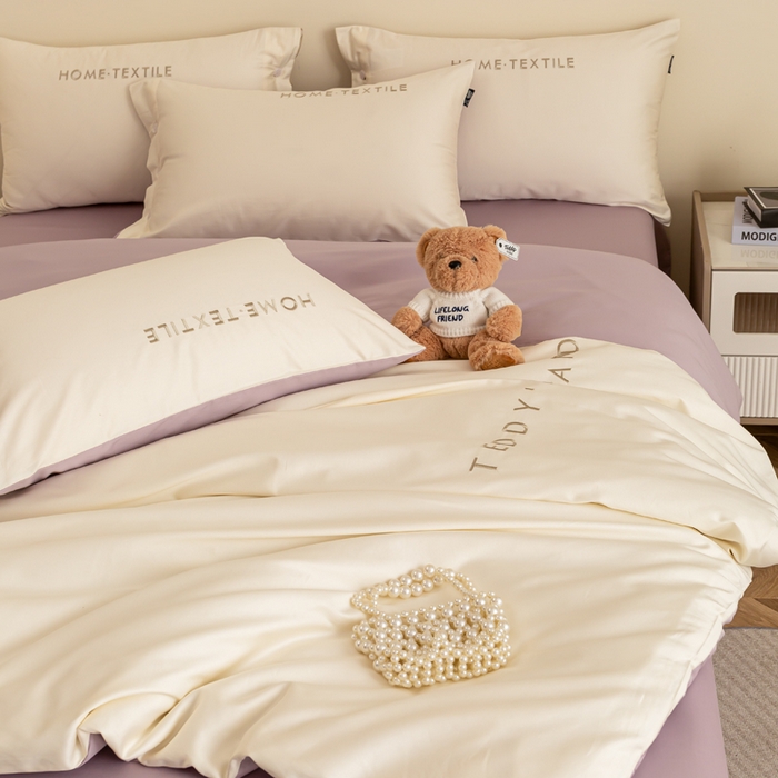 91家纺网 家纺一手货源 找家纺 泰迪爱兰Teddy 2025新款100支（50支）全棉贡缎字母绣花四件套 象牙白+加伦紫