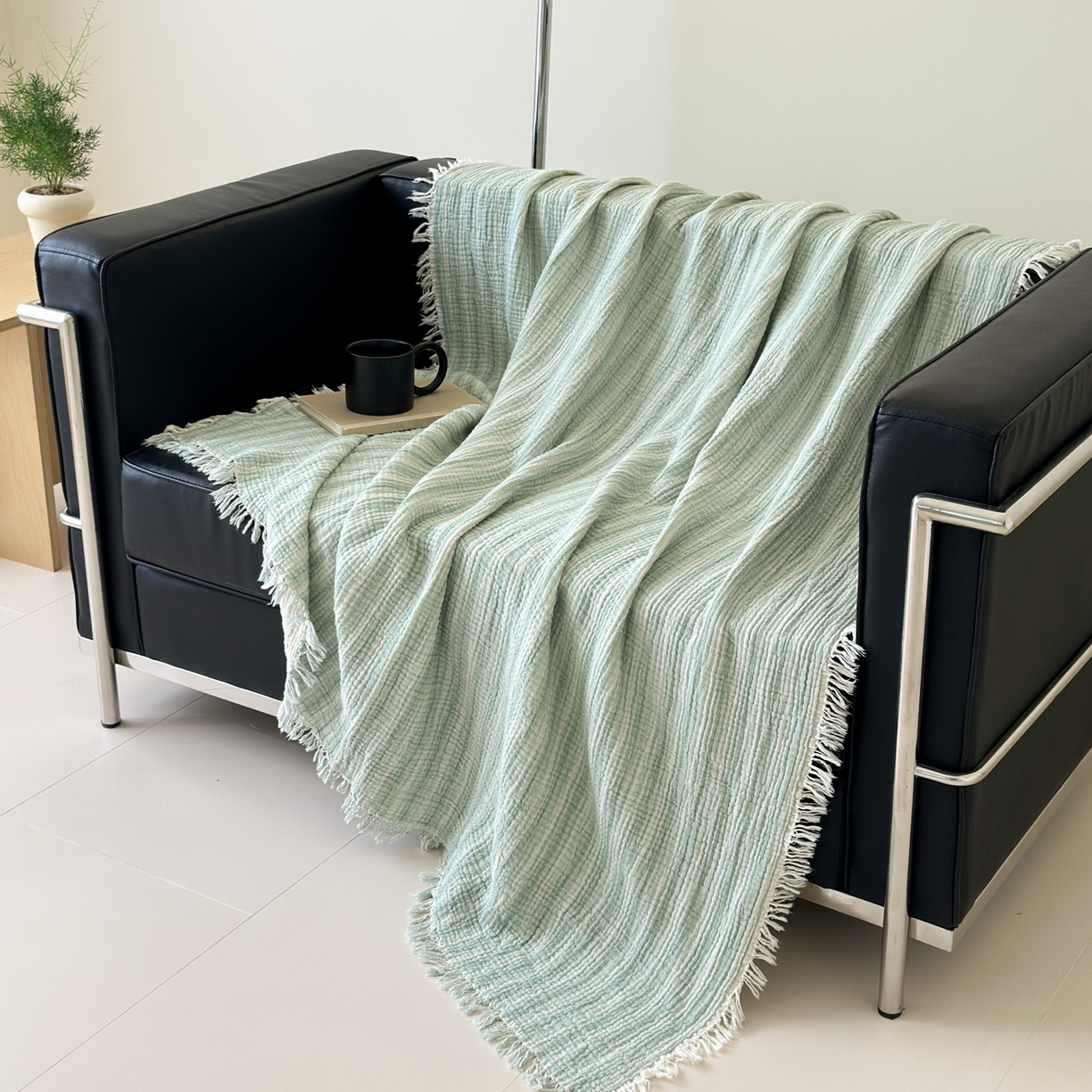 91家纺网 家纺一手货源 找家纺 （总）淑女公社家纺 2025新款双色全棉纯棉皱皱纱流苏毯