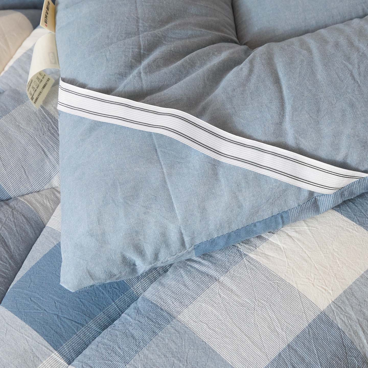 91家纺网 家纺一手货源 找家纺 爱屋及屋 2025款无印风学生棉花床垫 蓝中格