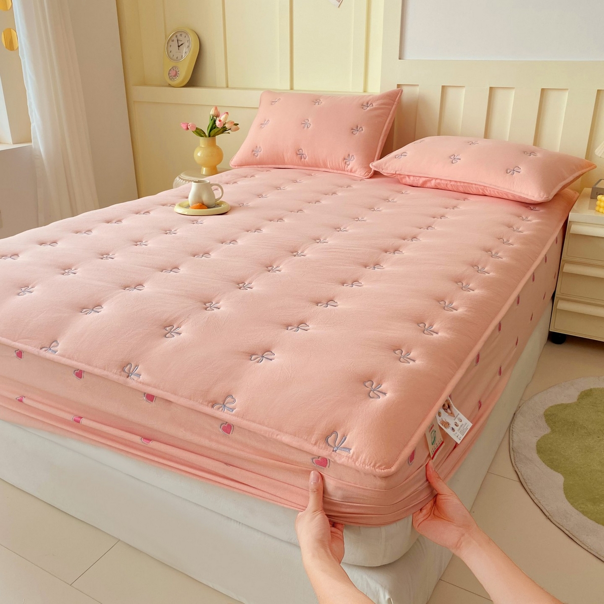 91家纺网 家纺一手货源 找家纺 尊康家纺（原磊科） 2025新款7A抗菌全棉色织水洗棉大豆棉填充床笠-同心结 同心结-粉玉