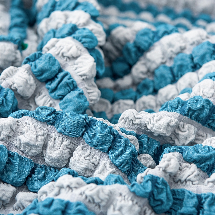 91家纺网 家纺一手货源 找家纺 布兰鸟【沙发套】 2025新款泡泡沙发套【英文裙摆款】单人沙发风格 双色蓝