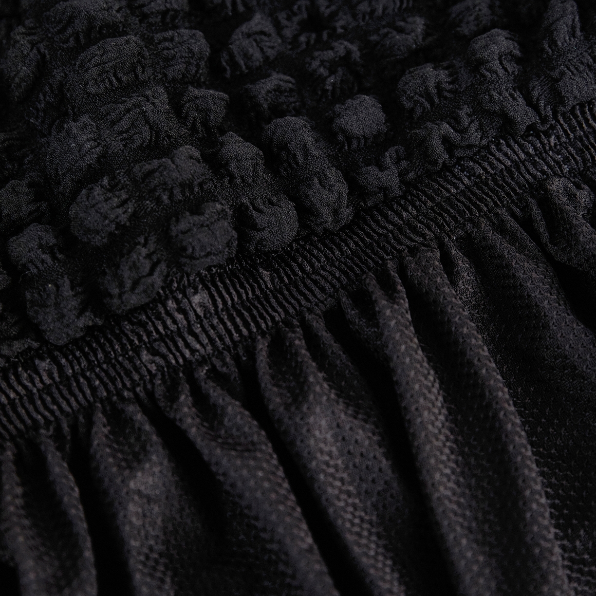 91家纺网 家纺一手货源 找家纺 布兰鸟【沙发套】 2025新款泡泡沙发套四人位【英文裙摆款】 单色黑