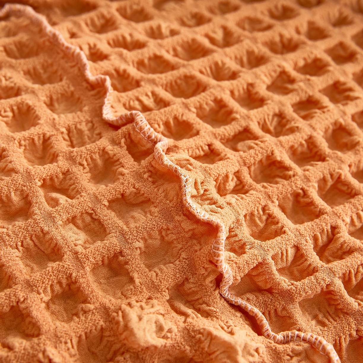 91家纺网 家纺一手货源 找家纺 布兰鸟【沙发套】 2025新款泡泡沙发套四人位【英文裙摆款】 单色肉橙