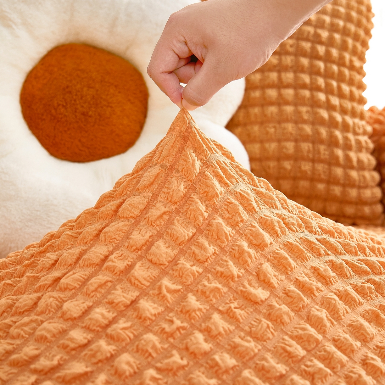 91家纺网 家纺一手货源 找家纺 布兰鸟【沙发套】 2025新款泡泡沙发套四人位【英文裙摆款】 单色肉橙