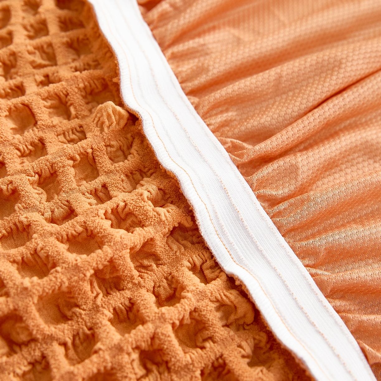 91家纺网 家纺一手货源 找家纺 布兰鸟【沙发套】 2025新款泡泡沙发套四人位【英文裙摆款】 单色肉橙