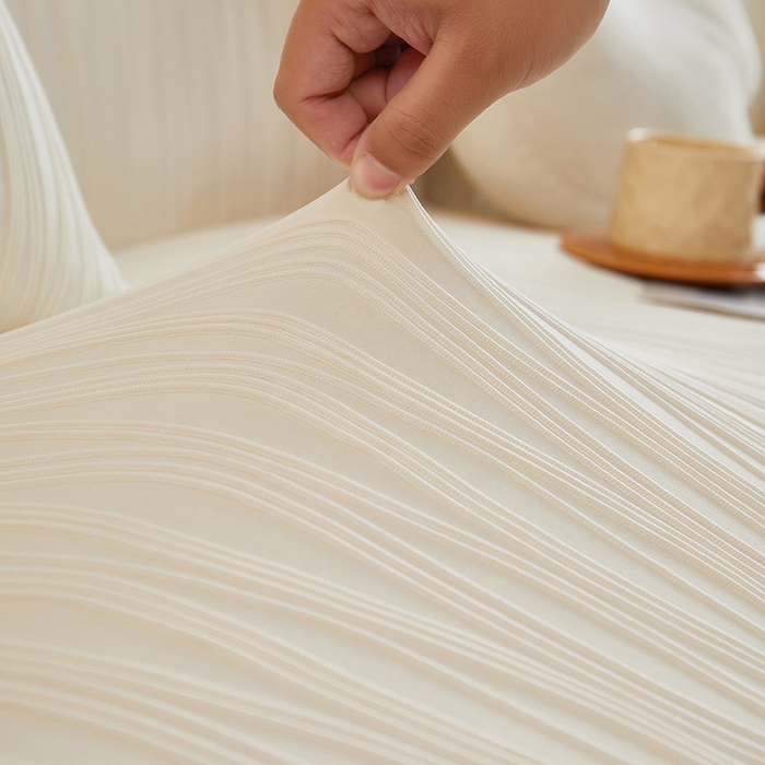 91家纺网 家纺一手货源 找家纺 丝绮鹿 2025新款提花绒沙发套水波纹松紧款 米白