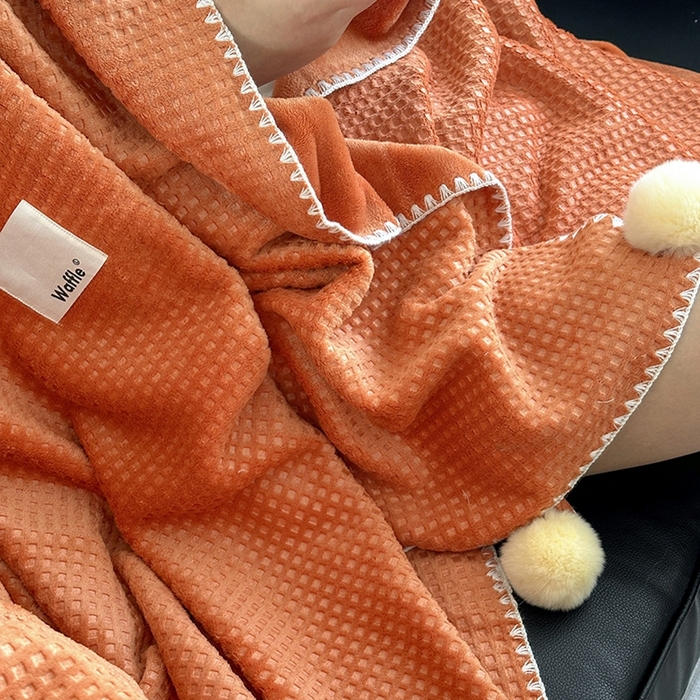 91家纺网 家纺一手货源 找家纺 艾佳 2025新款华夫格升级版毛球款四季毯盖毯毛毯毯子 星光球桔