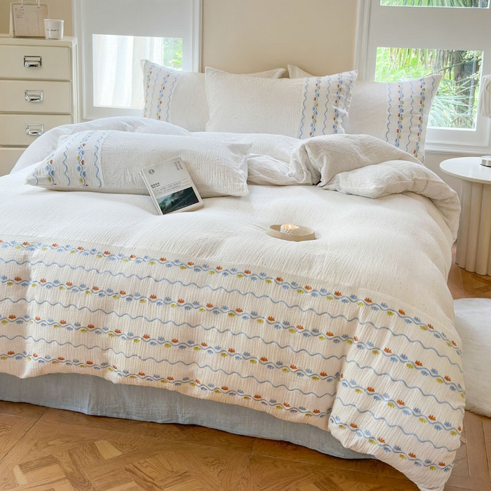 91家纺网 家纺一手货源 找家纺 木楌家居2025新款全棉彩点皱皱纱绣花四件套 织梦星河