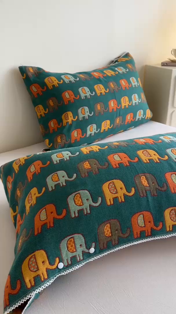 91家纺网 家纺一手货源 找家纺 朴尔家纺-毛巾被2025新款半包可调节暗扣魔术全棉三层纱布枕巾 多彩小象-绿黄