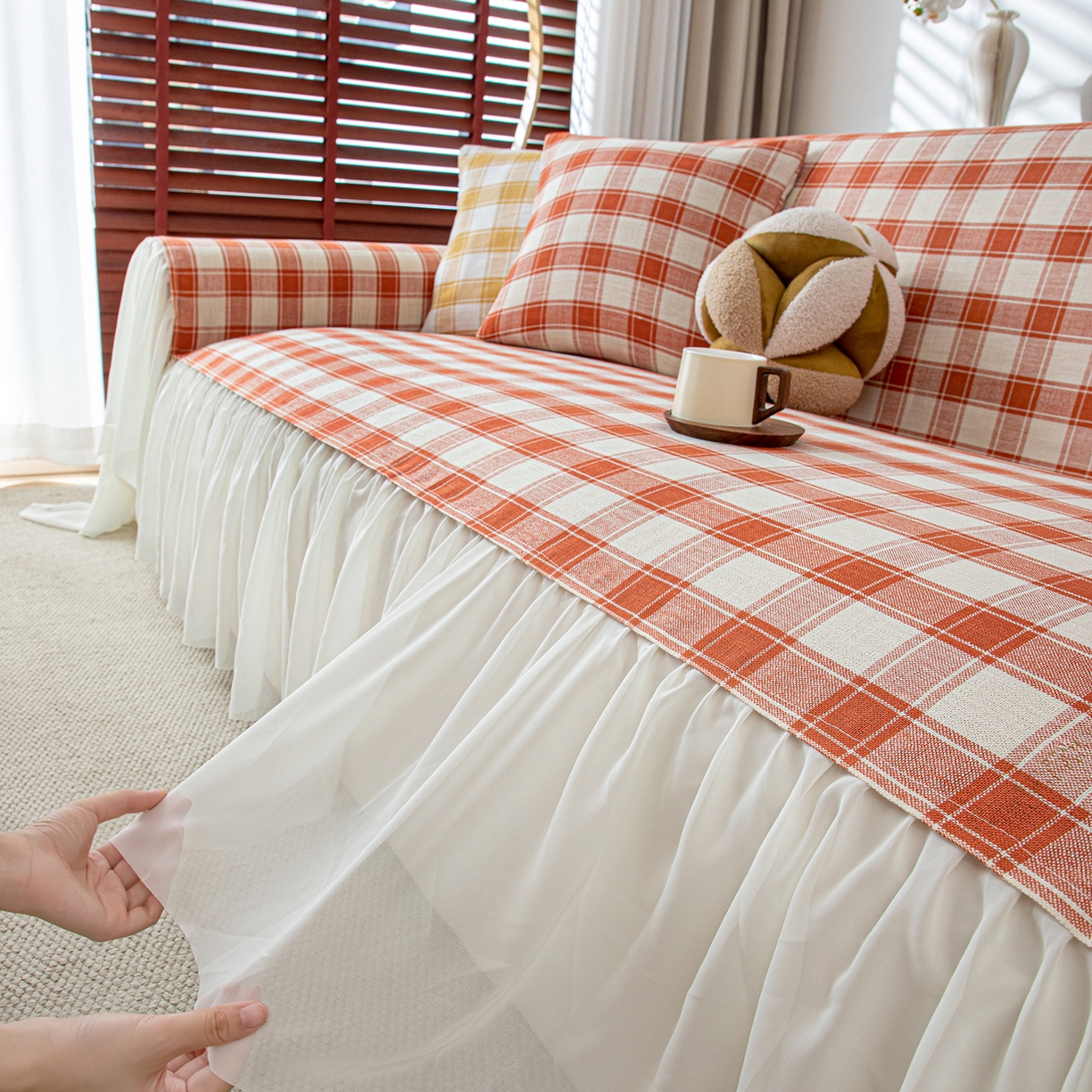 91家纺网 家纺一手货源 找家纺 沐沐家纺 2026新款棋格裙边沙发巾 橘棋格