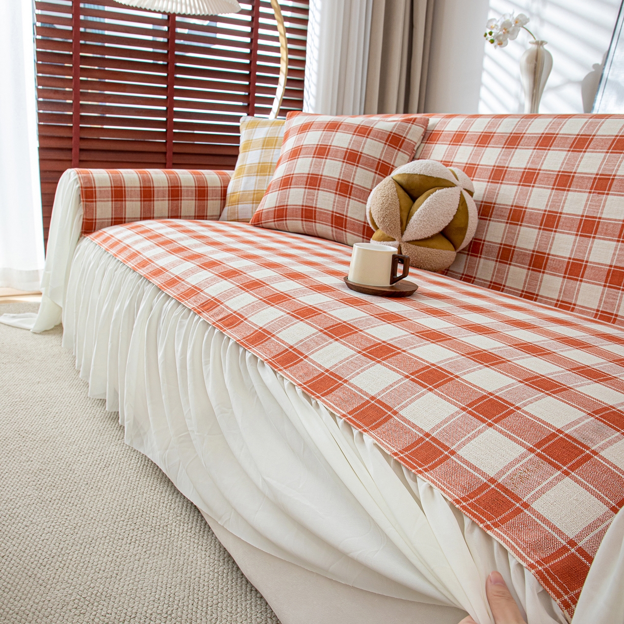 91家纺网 家纺一手货源 找家纺 沐沐家纺 2026新款棋格裙边沙发巾 橘棋格