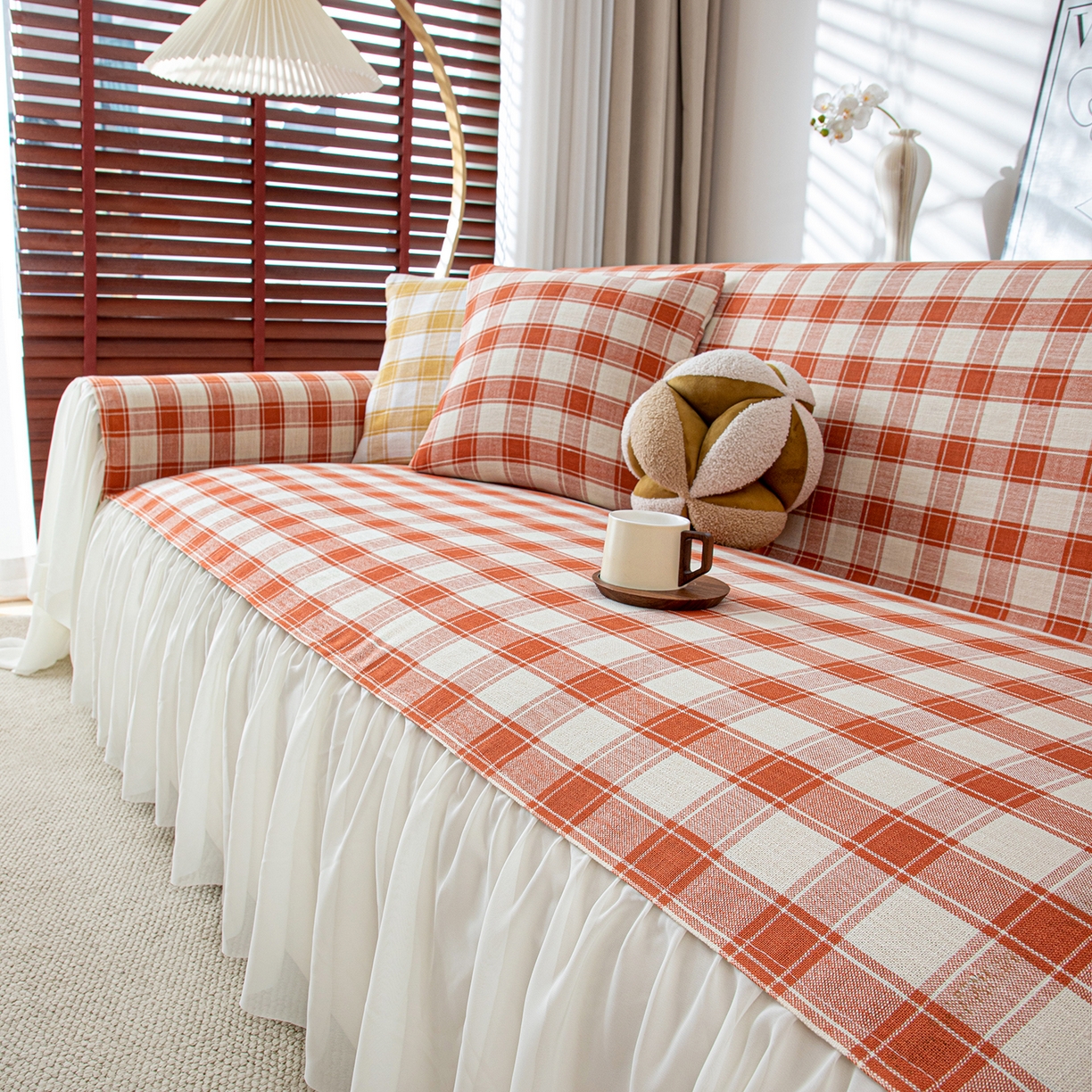 91家纺网 家纺一手货源 找家纺 沐沐家纺 2026新款棋格裙边沙发巾 橘棋格