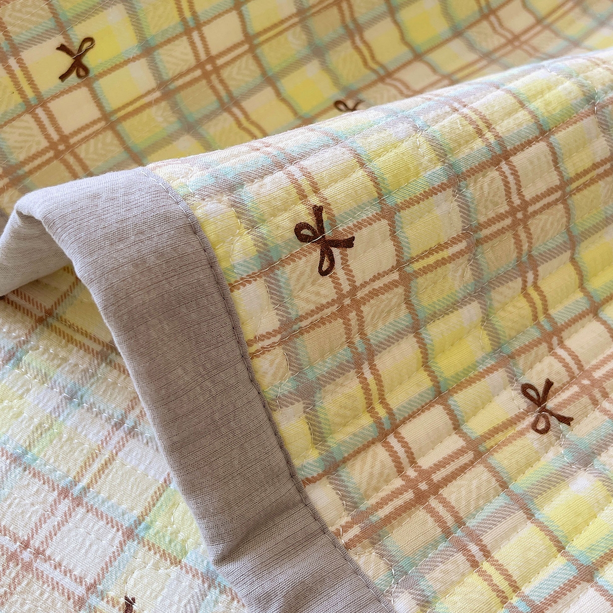 91家纺网 家纺一手货源 找家纺 雨彤家纺 2025新款A类双层纱夹棉单人枕巾 格调蝴蝶结