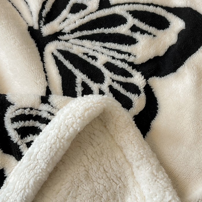 91家纺网 家纺一手货源 找家纺 美洲琳 2025新款羊羔绒复合简约现代休闲毯 蝴蝶