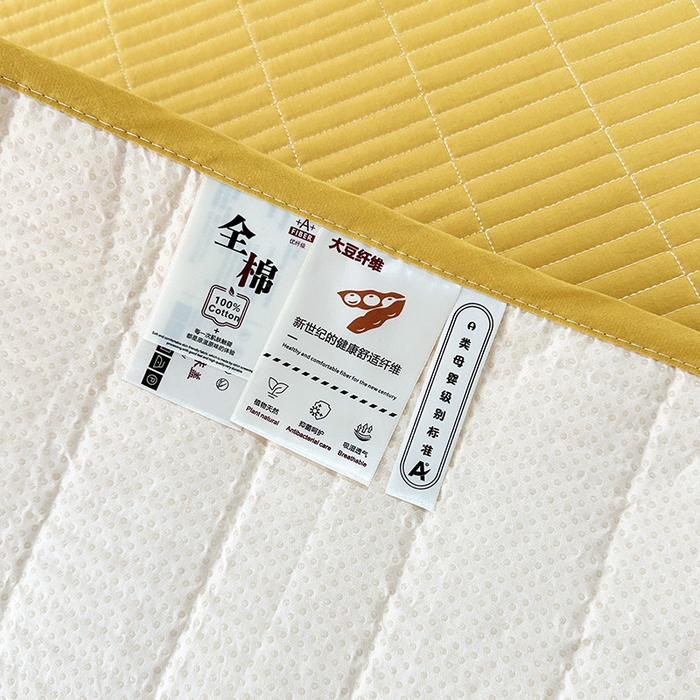 91家纺网 家纺一手货源 找家纺 拾小柒 2025新款全棉色织水洗棉夹棉防滑床盖防水纯色床护垫 防水款姜黄色
