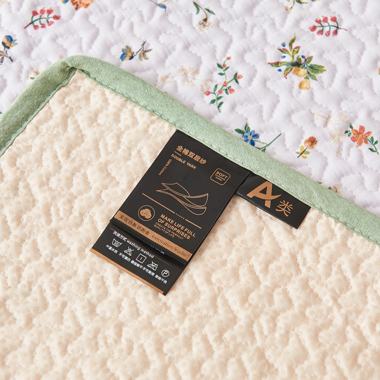 91家纺网 家纺一手货源 找家纺 拾小柒 2025年新款全棉双层纱防水隔脏姨妈垫护理垫隔尿垫 春色满园（透气款）