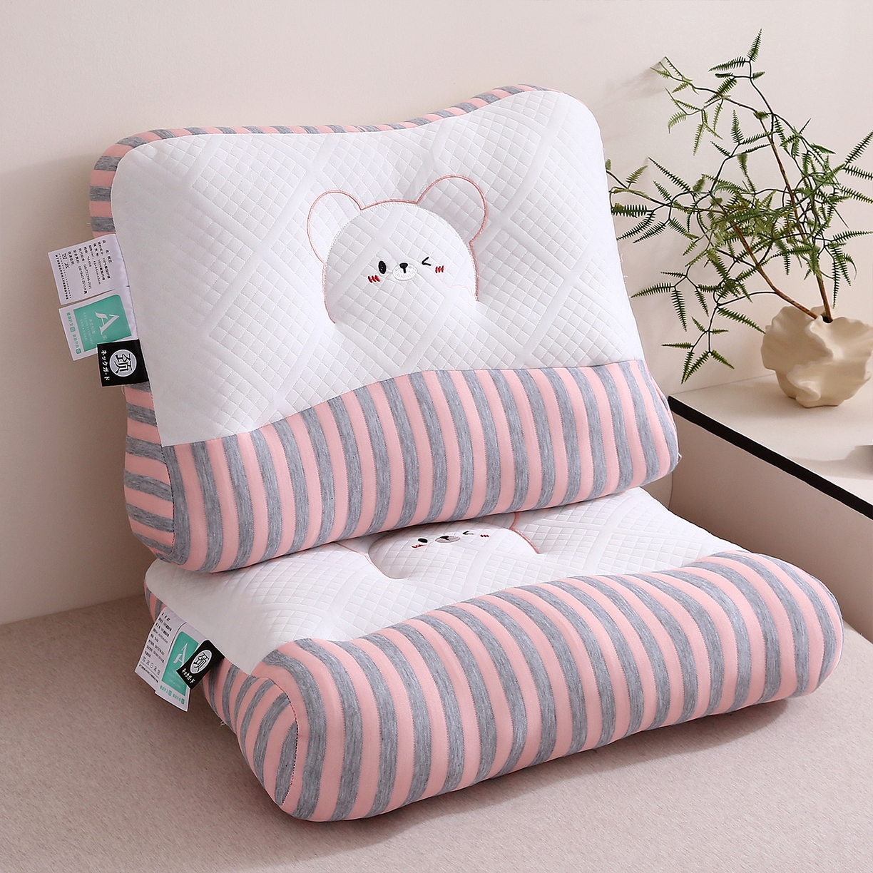 91家纺网 家纺一手货源 找家纺 梦叶草 2025新款SPA护颈椎枕助睡眠情侣反牵引侧睡枕头枕芯 情侣笑脸护颈枕-粉色