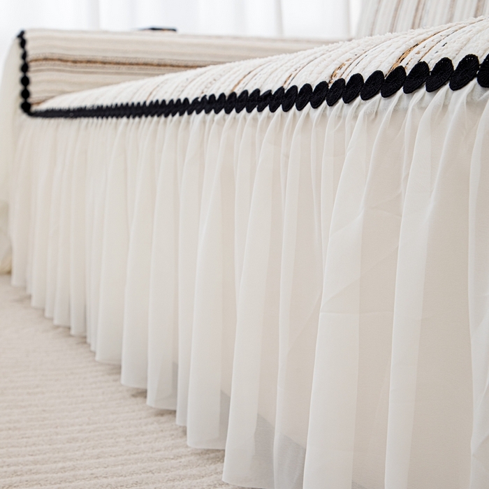 91家纺网 家纺一手货源 找家纺 沐沐家纺 2026新款织织暮圆点沙发巾-场景一 浅咖