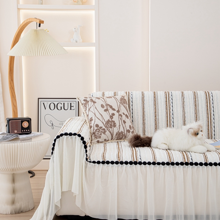 91家纺网 家纺一手货源 找家纺 沐沐家纺 2026新款织织暮圆点沙发巾-场景一 浅咖