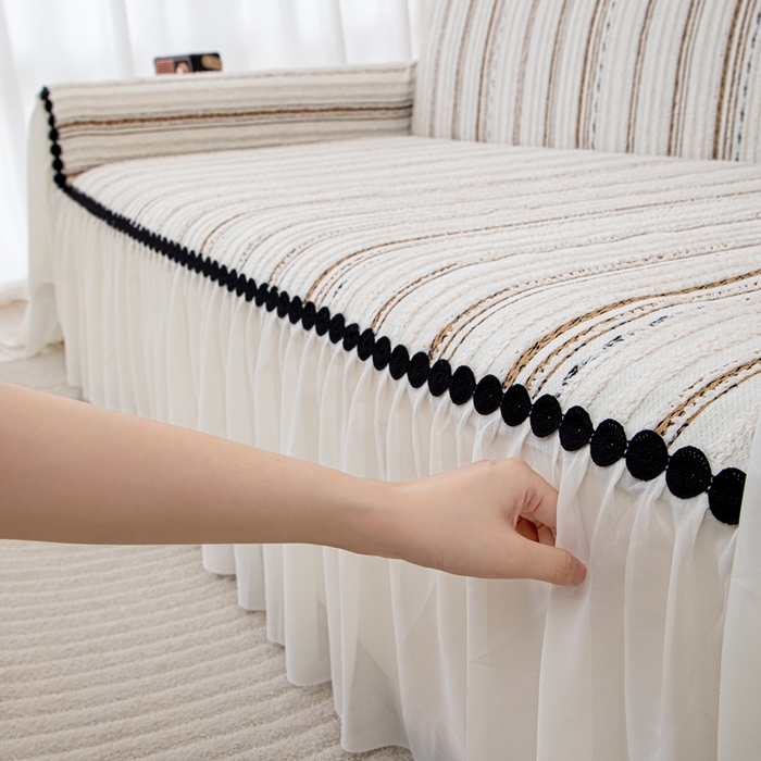 91家纺网 家纺一手货源 找家纺 沐沐家纺 2026新款织织暮圆点沙发巾-场景一 浅咖