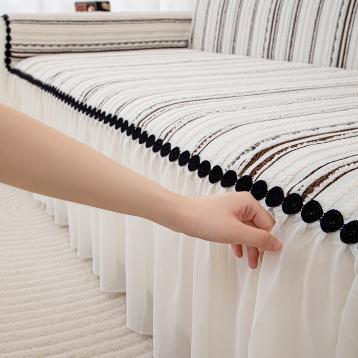 91家纺网 家纺一手货源 找家纺 沐沐家纺 2026新款织织暮圆点沙发巾-场景一 深咖