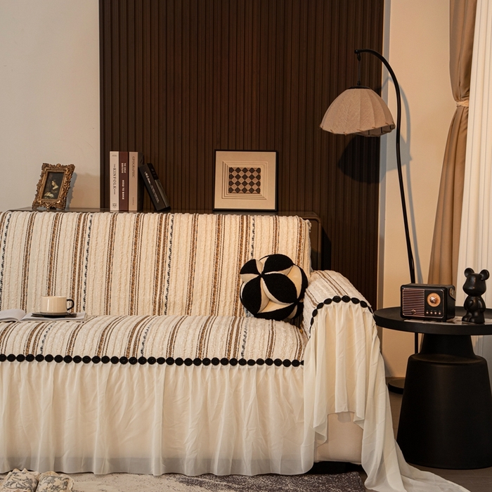 91家纺网 家纺一手货源 找家纺 沐沐家纺 2026新款织织暮圆点沙发巾-场景二 浅咖