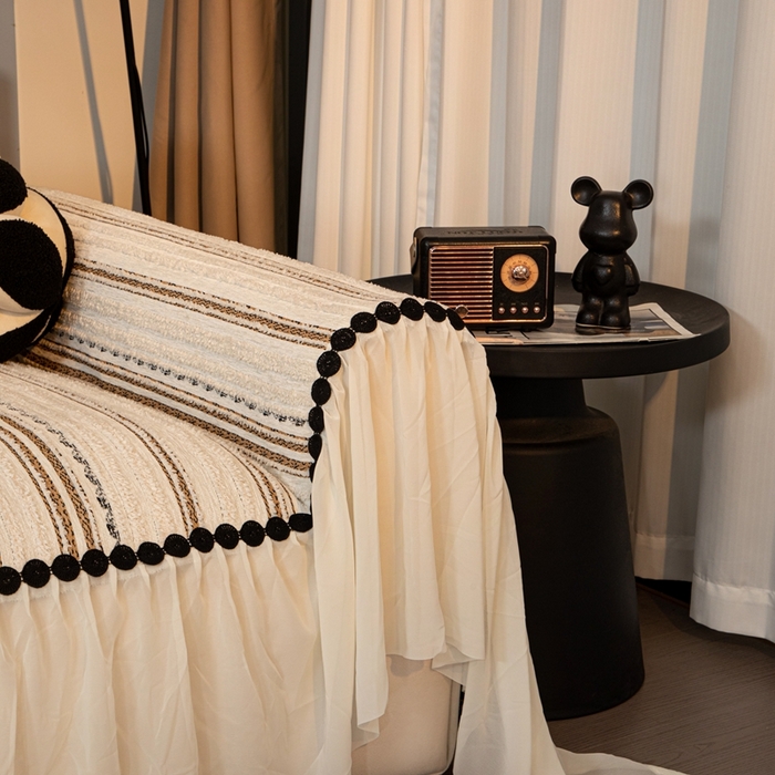 91家纺网 家纺一手货源 找家纺 沐沐家纺 2026新款织织暮圆点沙发巾-场景二 浅咖