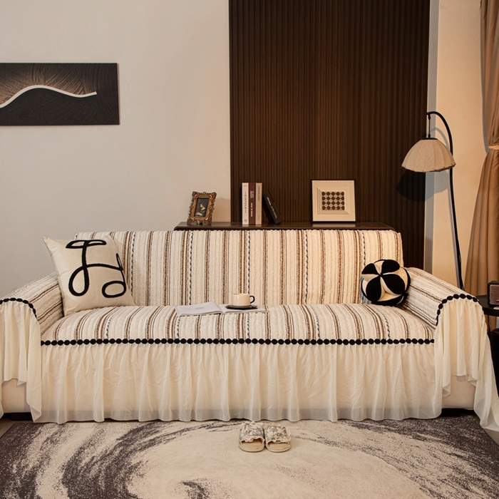 91家纺网 家纺一手货源 找家纺 沐沐家纺 2026新款织织暮圆点沙发巾-场景二 浅咖