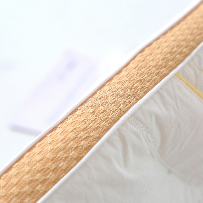 91家纺网 家纺一手货源 找家纺 糖果枕芯 2025新款儿童枕芯分区护颈学生枕头全棉枕芯 喜豆橙色边