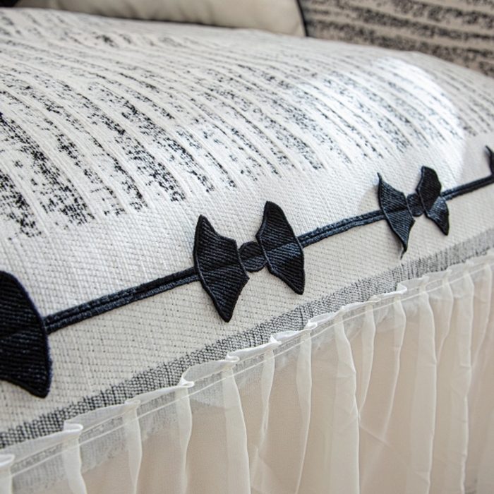 91家纺网 家纺一手货源 找家纺 沐沐家纺 2026新款宛柔蝴蝶结裙边沙发巾 黑色