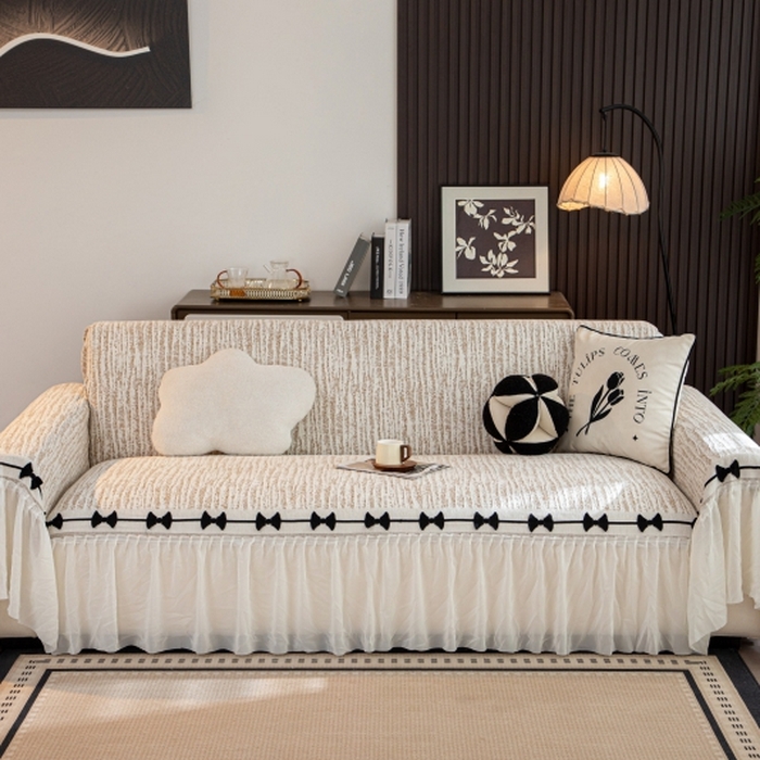 91家纺网 家纺一手货源 找家纺 沐沐家纺 2026新款宛柔蝴蝶结裙边沙发巾 驼色