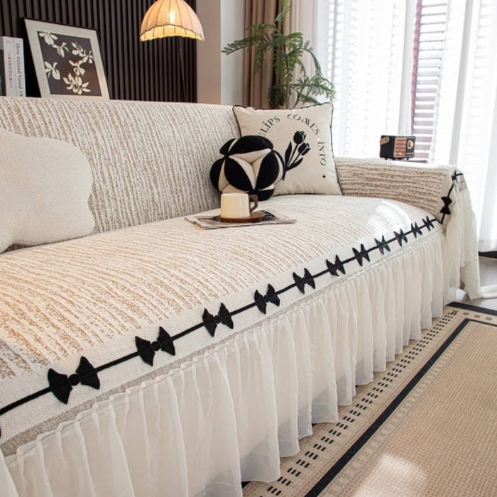 91家纺网 家纺一手货源 找家纺 沐沐家纺 2026新款宛柔蝴蝶结裙边沙发巾 驼色