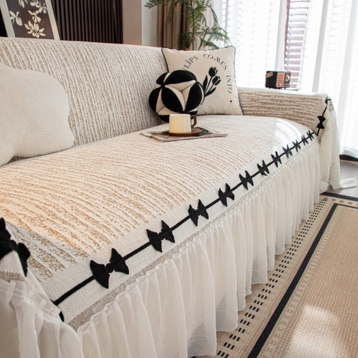 91家纺网 家纺一手货源 找家纺 沐沐家纺 2026新款宛柔蝴蝶结裙边沙发巾 驼色