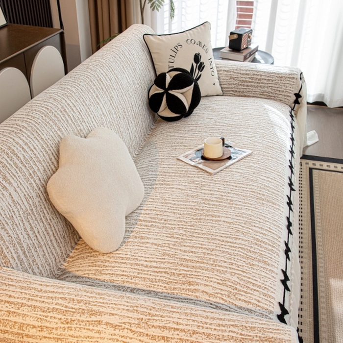 91家纺网 家纺一手货源 找家纺 沐沐家纺 2026新款宛柔蝴蝶结裙边沙发巾 驼色