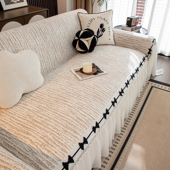 91家纺网 家纺一手货源 找家纺 沐沐家纺 2026新款宛柔蝴蝶结裙边沙发巾 驼色