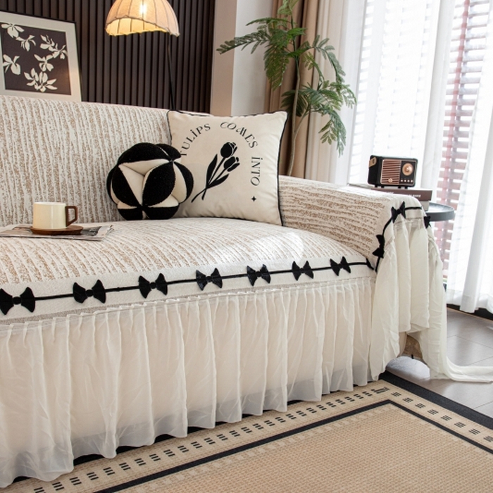 91家纺网 家纺一手货源 找家纺 沐沐家纺 2026新款宛柔蝴蝶结裙边沙发巾 驼色