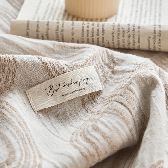 91家纺网 家纺一手货源 找家纺 大彩家居 2025新款棉麻流苏毯 ‌摩登几何