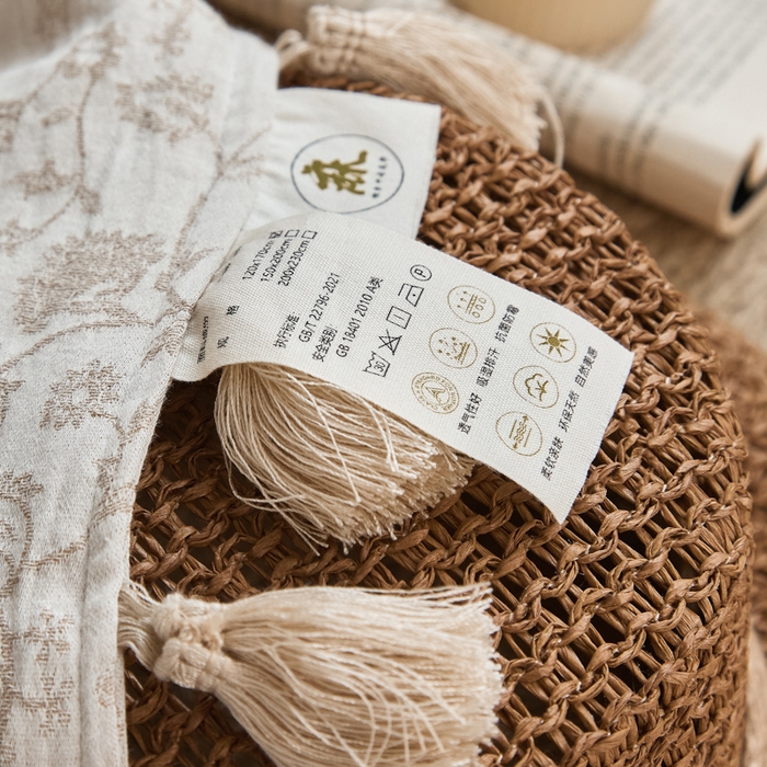 91家纺网 家纺一手货源 找家纺 大彩家居 2025新款棉麻流苏毯 ‌藤蔓