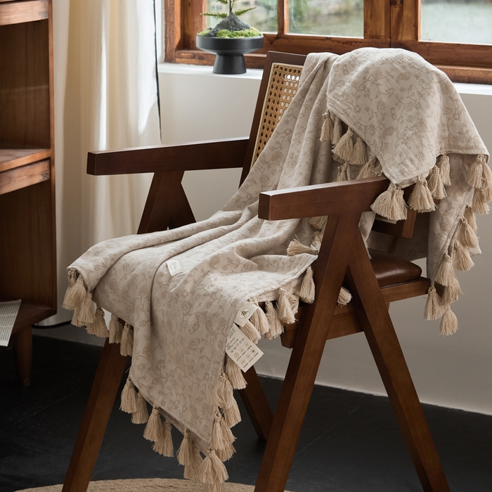 91家纺网 家纺一手货源 找家纺 大彩家居 2025新款棉麻流苏毯 ‌藤蔓